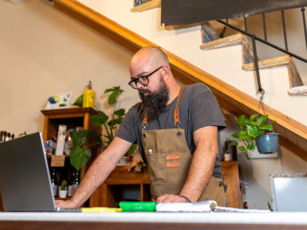 Business owner reviewing funding options on a laptop